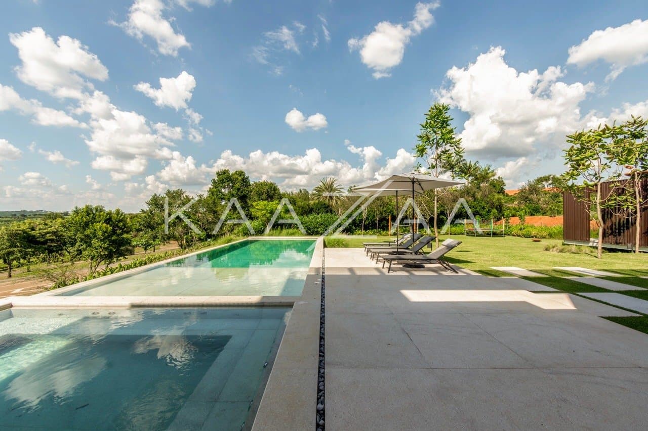 Casa contemporânea feita para interagir com a natureza ao redor. Projeto na Quinta da Baroneza. - Foto 1